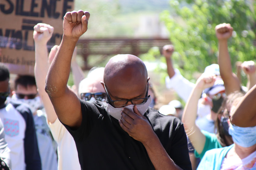 Protesters raise fists during June 7 demonstrations decrying racism in Castle Rock.
